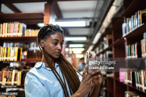 Scan Library Book Scanning Books In The Library Photos and Premium High Res Pictures ...