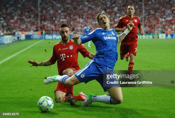 Fernando Torres of Chelsea is tackled by Diego Contento of Bayern Muenchen during UEFA Champions League Final between FC Bayern Muenchen and Chelsea...