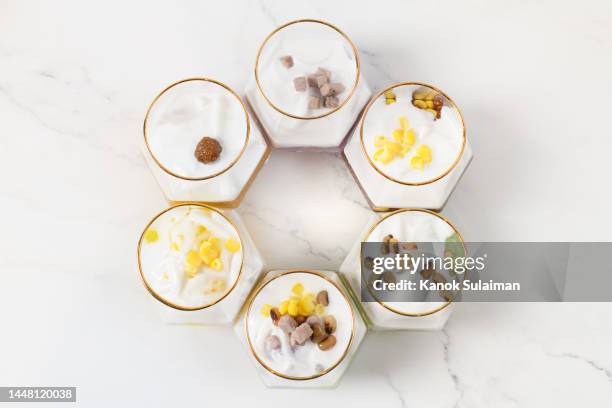 wholegrain food shot in glass on white table - large group of objects stock pictures, royalty-free photos & images
