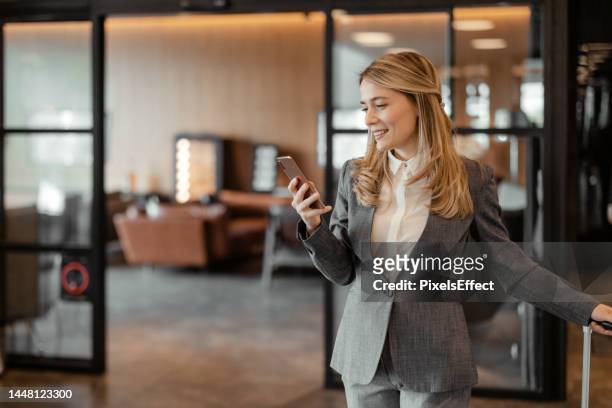she's still got some business to take care of - airport lounge luxury stockfoto's en -beelden