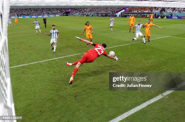 Wout Weghorst of Netherlands scores the team's first goal past Emiliano Martinez of Argentina during the FIFA World Cup Qatar 2022 quarter final...