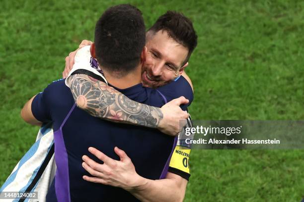 Lionel Scaloni, Head Coach of Argentina, celebrates with Lionel Messi after the win in the penalty shootout during the FIFA World Cup Qatar 2022...