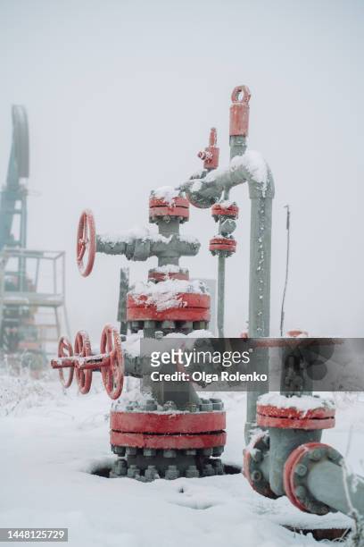 natural resource mining and pipe working in cold season in siberia - frozen pipes stock pictures, royalty-free photos & images