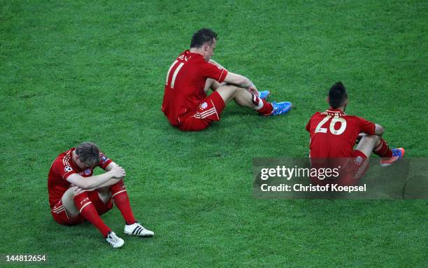 Toni Kroos , Ivica Olic and Diego Contento of Bayern look dejected after their defeat in the UEFA Champions League Final between FC Bayern Muenchen...