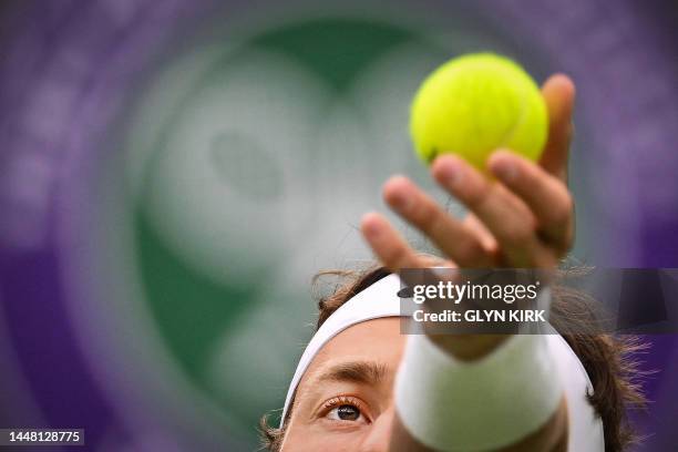 Norway's Casper Ruud serves the ball to France's Laurent Lokoli during their men's singles tennis match on the first day of the 2023 Wimbledon...