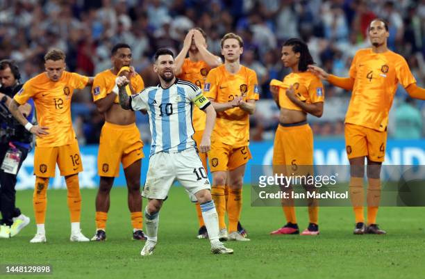 Lionel Messi of Argentina celebrates at full time after Argentina defeat the Netherlands on penalties during the FIFA World Cup Qatar 2022 quarter...