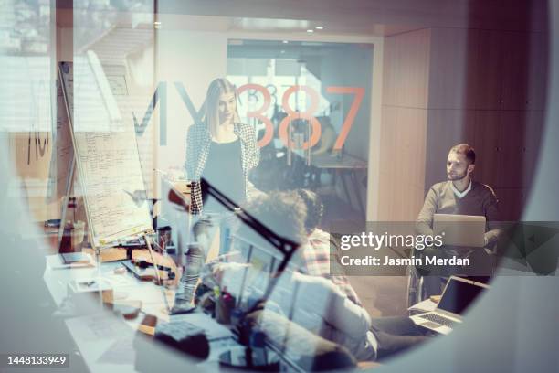 pregnant business woman and person with disability working in together - task force stockfoto's en -beelden