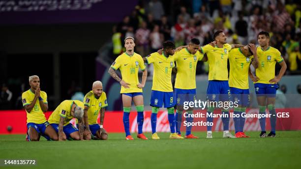 Rodrygo, Pedro, Neymar, Antony, Fred, Alex Sandro, Danilo, Thiago Silva and Casemiro of Brazil looking dejected after the FIFA World Cup Qatar 2022...