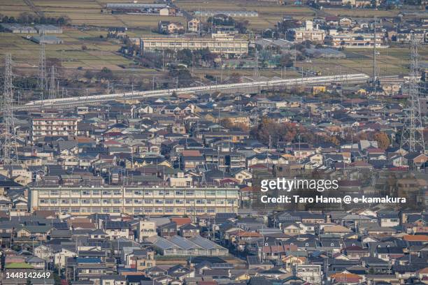 residential district by the railroad track in kanagawa of japan - n700s stockfoto's en -beelden