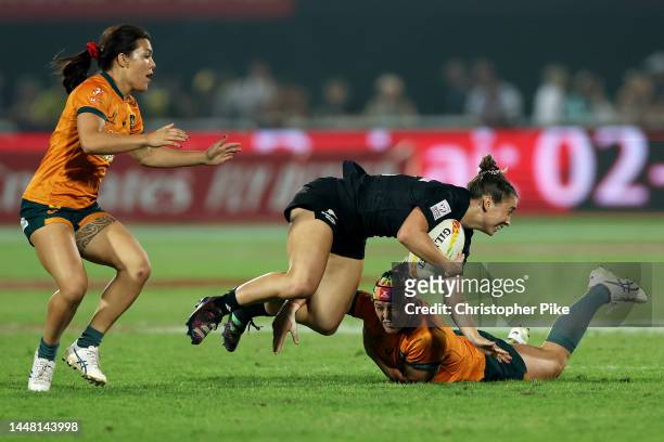 Jazmin Felix-Hotham of New Zealand is tackled by Sharni Williams of Australia as teammate Madison Ashby watches on during the Women's Cup Final match...
