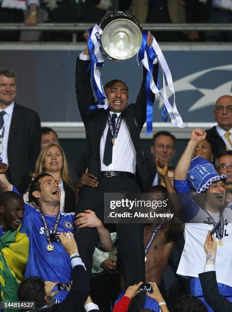 Roberto Di Matteo interim manager of Chelsea lifts the trophy in celebration after their victory in the UEFA Champions League Final between FC Bayern...