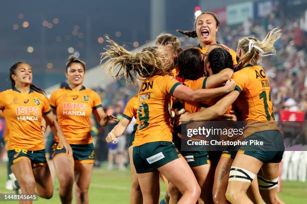 Players of Australia celebrate victory during the Women's Cup Final match between New Zealand and Australia on Day Two of the HSBC World Rugby...