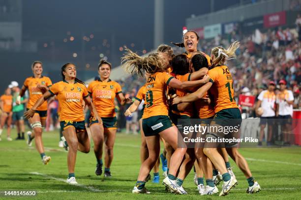 Players of Australia celebrate victory during the Women's Cup Final match between New Zealand and Australia on Day Two of the HSBC World Rugby...