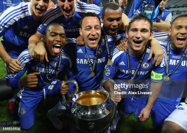 John Terry and Frank Lampard of Chelsea hold the trophy in celebration and celebrate with team mates after their victory in the UEFA Champions League...