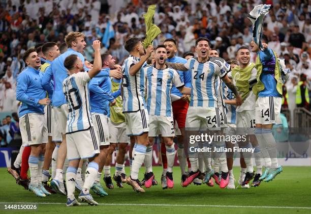 Argentina players celebrate after their win in the penalty shootout during the FIFA World Cup Qatar 2022 quarter final match between Netherlands and...