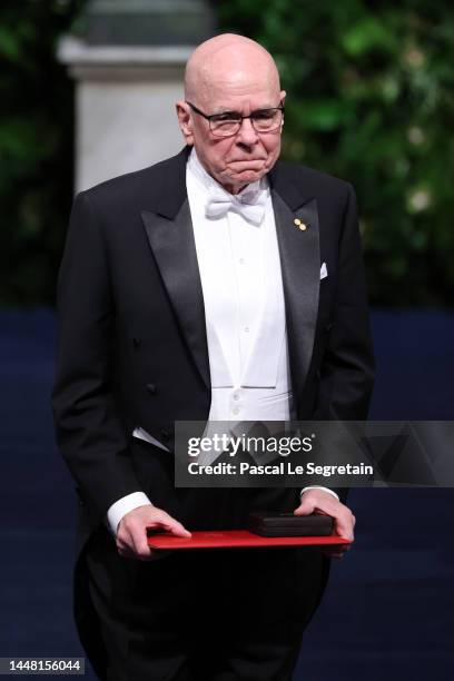 Professor K. Barry Sharpless poses with the 2022 Nobel Prize in Chemistry during the Nobel Prize Awards Ceremony at Stockholm Concert Hall on...