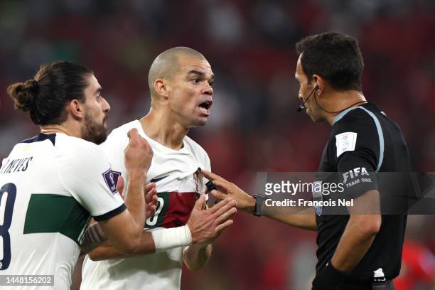 Referee Facundo Tello speaks to Pepe of Portugal after an incident during the FIFA World Cup Qatar 2022 quarter final match between Morocco and...
