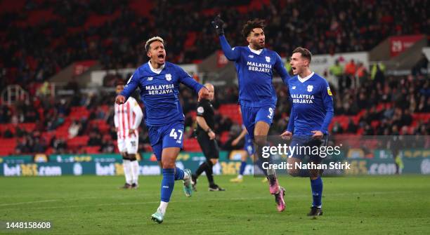 Callum Robinson of Cardiff City celebrates after he scores their second goal during the Sky Bet Championship between Stoke City and Cardiff City at...