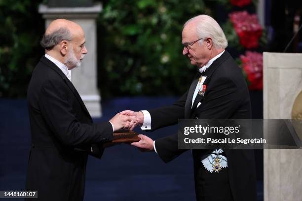 Dr Ben S. Bernanke receives the 2022 Sveriges Riksbank Prize in Economic Sciences in Memory of Alfred Nobel from King Carl XVI Gustaf of Sweden...