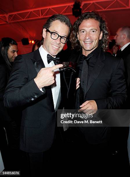 Actor Guy Pearce and Manuele Malenotti attend the 'Lawless' after party hosted byJohnnie Walker Blue Label, Chopard and Manuele Malenotti during the...