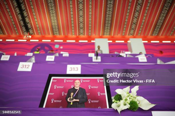 Flowers are placed in memory of Grant Wahl, an American sports journalist who passed away whilst reporting on the Argentina and Netherlands match,...