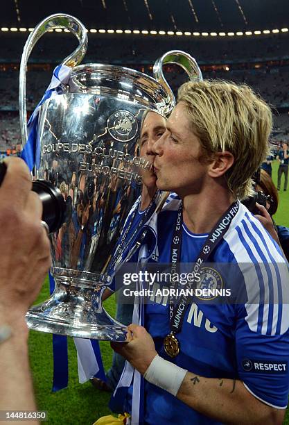 Chelsea's Spanish forward Fernando Torres kisses the trophy after the UEFA Champions League final football match between FC Bayern Muenchen and...