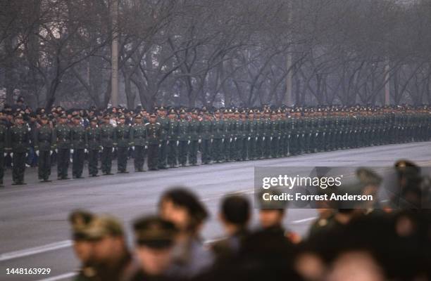 Soldiers line the street along the road for Deng Xiaoping's funeral procession, Beijing, China, February 25, 1997.