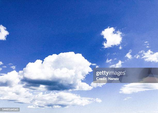 low angle view of blue sky - high noon stock-fotos und bilder