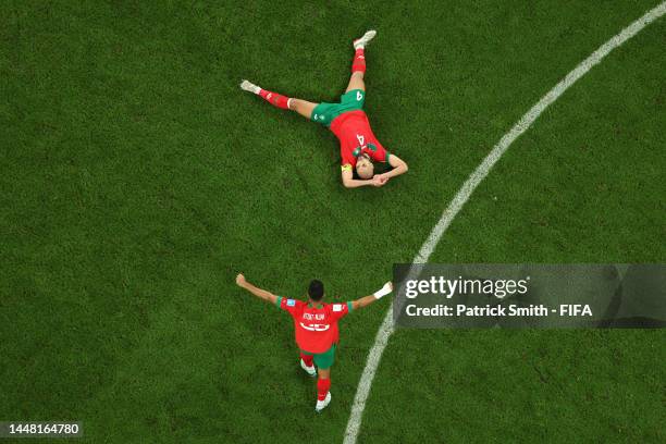 Yahya Attiat-Allah and Sofyan Amrabat of Morocco celebrate after the 1-0 win during the FIFA World Cup Qatar 2022 quarter final match between Morocco...