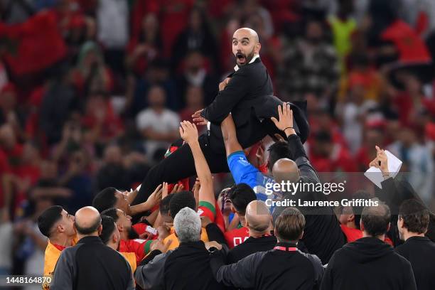 Walid Regragui, Head Coach of Morocco, celebrates with the team after the 1-0 win during the FIFA World Cup Qatar 2022 quarter final match between...