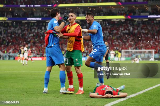 Yassine Bounou, Bilal El Khannouss, Reda Tagnaouti and Achraf Hakimi of Morocco celebrate the team's 1-0 victory in the FIFA World Cup Qatar 2022...