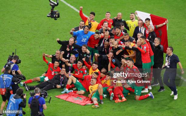 Morocco players celebrate after the 1-0 win during the FIFA World Cup Qatar 2022 quarter final match between Morocco and Portugal at Al Thumama...