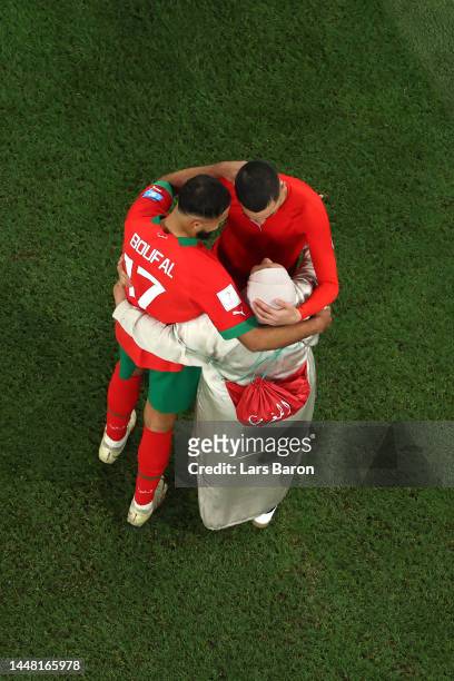 Sofiane Boufal of Morocco celebrates with family members after the team's 1-0 victory in the FIFA World Cup Qatar 2022 quarter final match between...