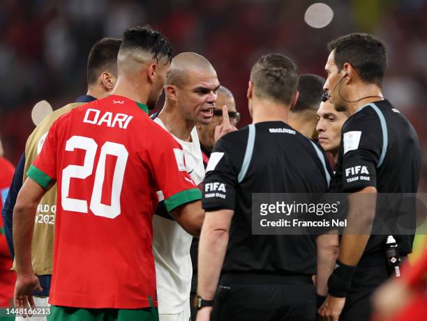 Pepe of Portugal speaks to Referee Facundo Tello after the team's defeat during the FIFA World Cup Qatar 2022 quarter final match between Morocco and...