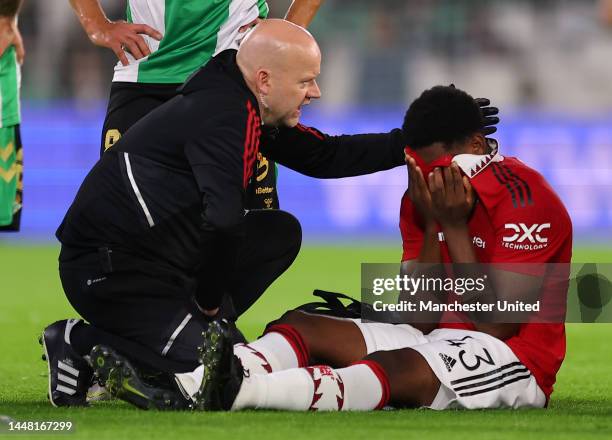 Teden Mengi of Manchester United receives treatment on an injury during the friendly match between Real Betis and Manchester United at Estadio Benito...