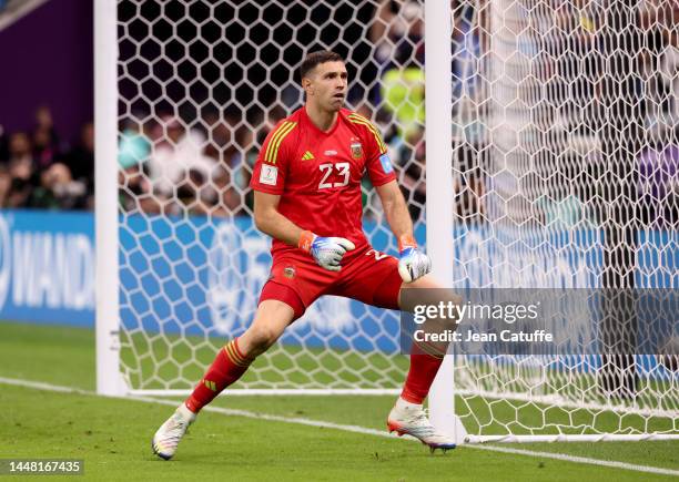 Argentina goalkeeper Emiliano Martinez aka Damian Martinez dancing after stopping a penalty during the penalty shootout of the FIFA World Cup Qatar...