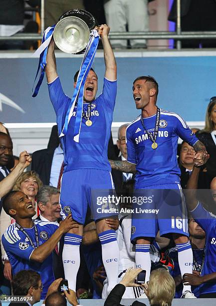John Terry of Chelsea lifts the trophy after their victory in the UEFA Champions League Final between FC Bayern Muenchen and Chelsea at the Fussball...