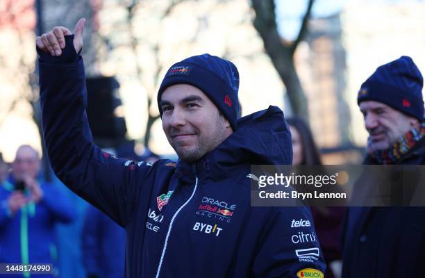 Sergio Perez of Mexico and Oracle Red Bull Racing waves to some fans during the Oracle Red Bull Racing Home Run event at Red Bull Racing Factory on...