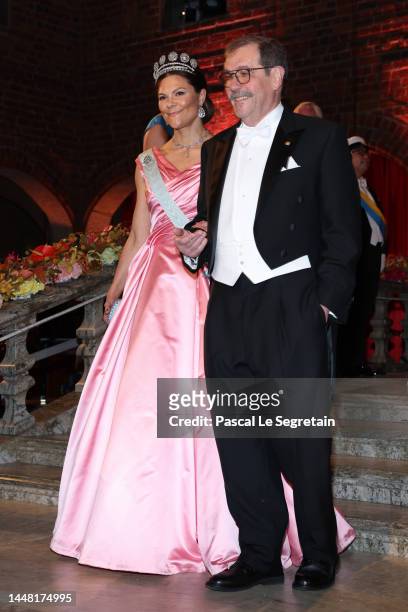 Crown Princess Victoria of Sweden and Professor Alain Aspect arrive at the Nobel Prize Banquet 2022 at Stockholm City Hall on December 10, 2022 in...
