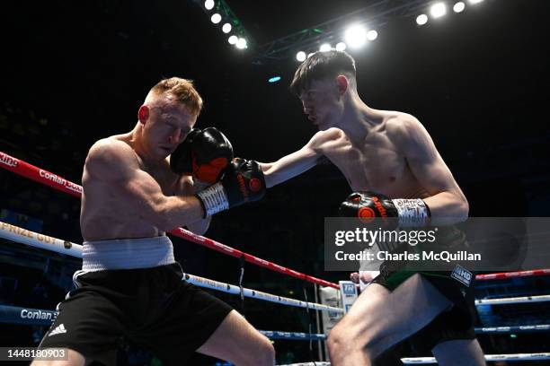Stephen Jackson and Conor Quinn exchange blows during their flyweight fight at Odyssey Arena on December 10, 2022 in Belfast, Northern Ireland.