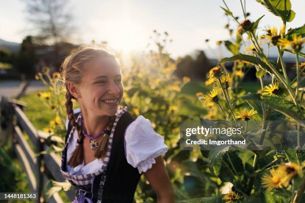 portrait of a teenage girl wearing traditional austrian dress - dirndl - dirndl stock pictures, royalty-free photos & images