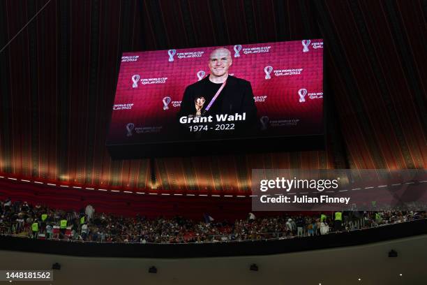 The LED board shows a photo of Grant Wahl, an American sports journalist who passed away whilst reporting on the Argentina and Netherlands match,...