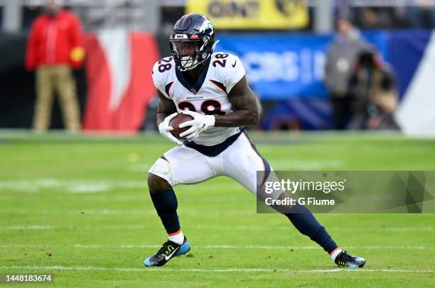 Latavius Murray of the Denver Broncos rushes the ball against the Baltimore Ravens at M&T Bank Stadium on December 04, 2022 in Baltimore, Maryland.