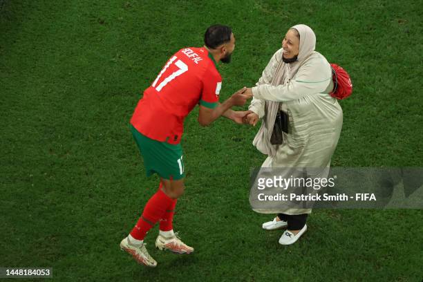 Sofiane Boufal of Morocco celebrates with his Mother after the team's 1-0 victory in the FIFA World Cup Qatar 2022 quarter final match between...