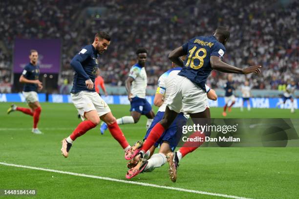 Harry Kane of England is challenged by Dayot Upamecano of France during the FIFA World Cup Qatar 2022 quarter final match between England and France...