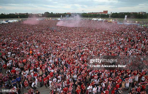 Soccer fans watch the UEFA Champions League final between FC Bayern Muenchen and Chelsea FC at public viewing at the Theresienwiese on May 19, 2012...