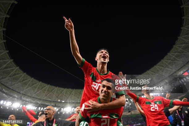 Achraf Dari and Walid Cheddira of Morocco celebrate the team's 1-0 victory in the FIFA World Cup Qatar 2022 quarter final match between Morocco and...