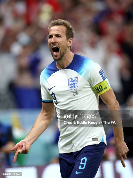 Harry Kane of England celebrates after scoring the team's first goal during the FIFA World Cup Qatar 2022 quarter final match between England and...