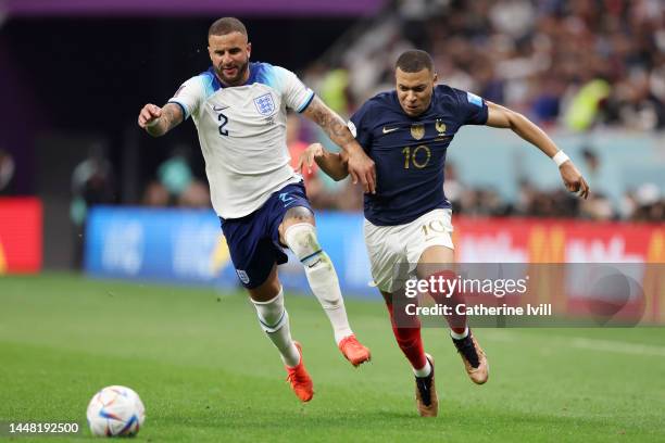 Kylian Mbappe of France and Kyle Walker of England compete for the ball during the FIFA World Cup Qatar 2022 quarter final match between England and...