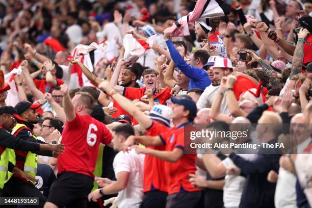 Fans of England celebrate their team's first goal during the FIFA World Cup Qatar 2022 quarter final match between England and France at Al Bayt...